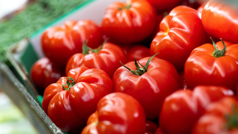 Close up of crate of fresh tomatoes