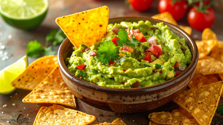Bowl of guacamole with corn chips