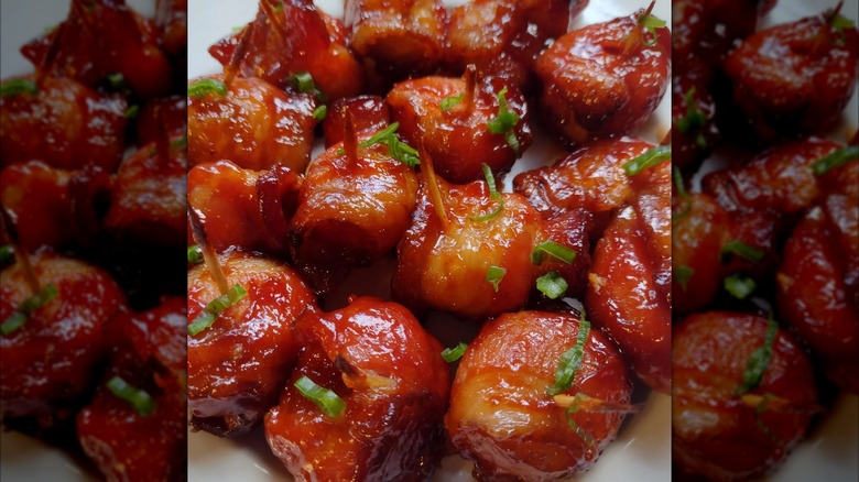 Rumaki appetizer on a white plate.