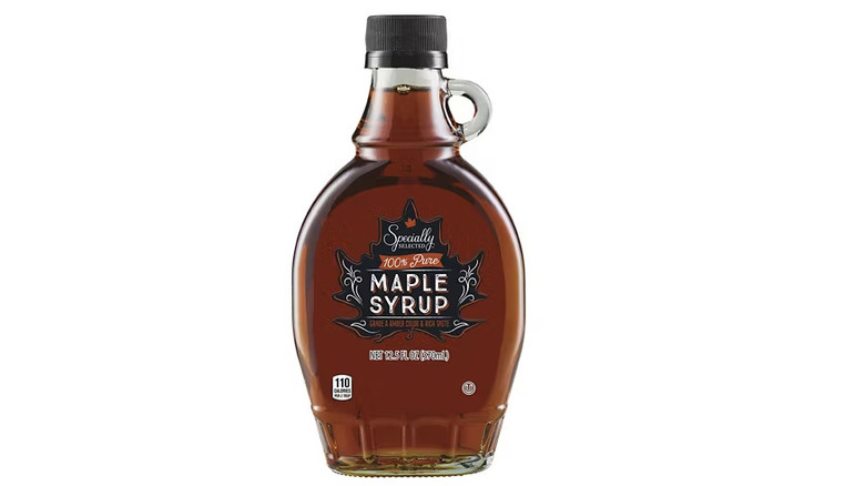 A glass bottle of Specially Selected maple syrup