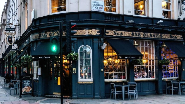 The dark green exterior of the Bag O'Nails pub in London.