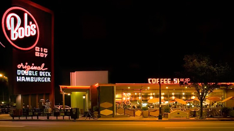 The outside of Bob's Big Boy diner lit up at night.