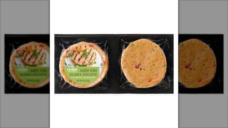 Two salmon burgers in plastic packaging