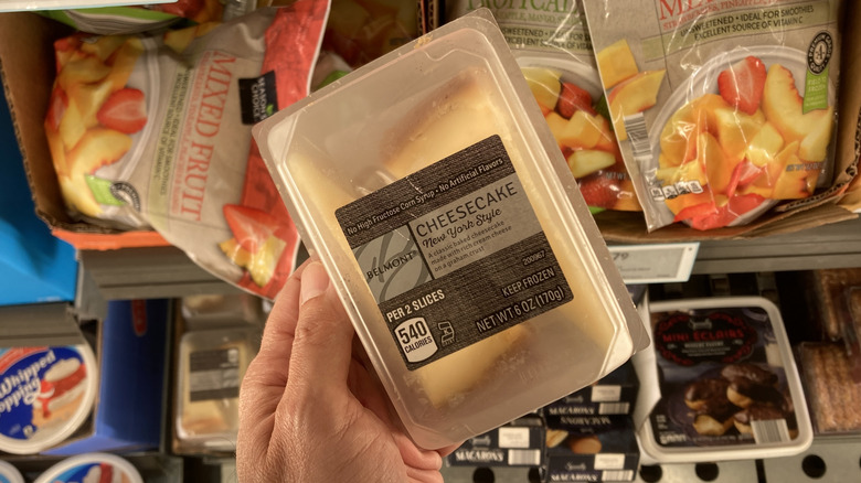 hand holding Aldi frozen cheesecake
