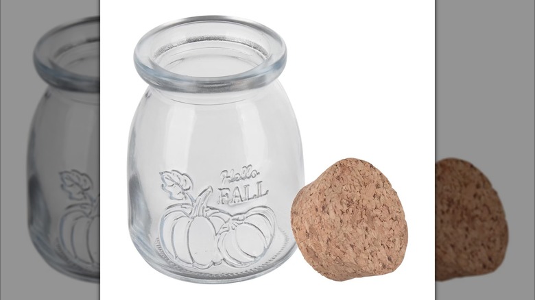 Glass jar with cork lid that says "hello fall"