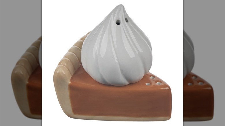 Slice of pumpkin pie and whipped cream salt and pepper shaker set