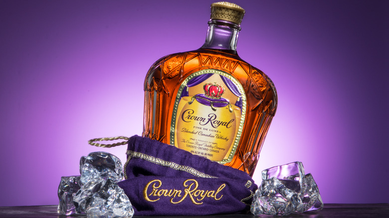 Crown Royal tilted before purple background