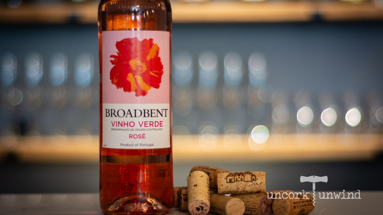 Bottle of Broadbent Vinho Verde next to a pile of corks