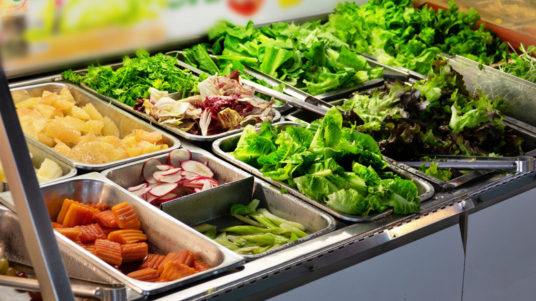 Salad bar with greens and vegetables