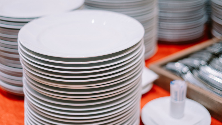 Stack of clean plates and forks