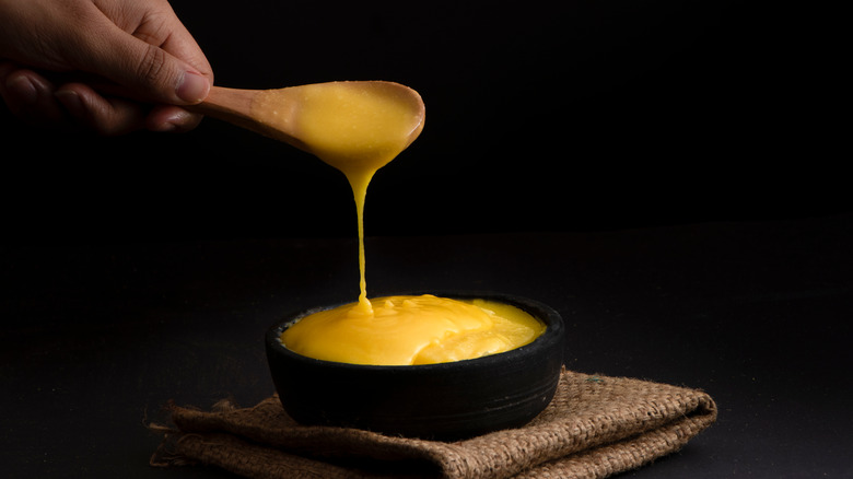 ghee oozing off the spoon