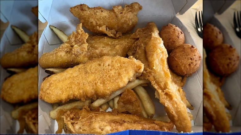 A takeout box of Long John Silver's Chicken Planks with fries