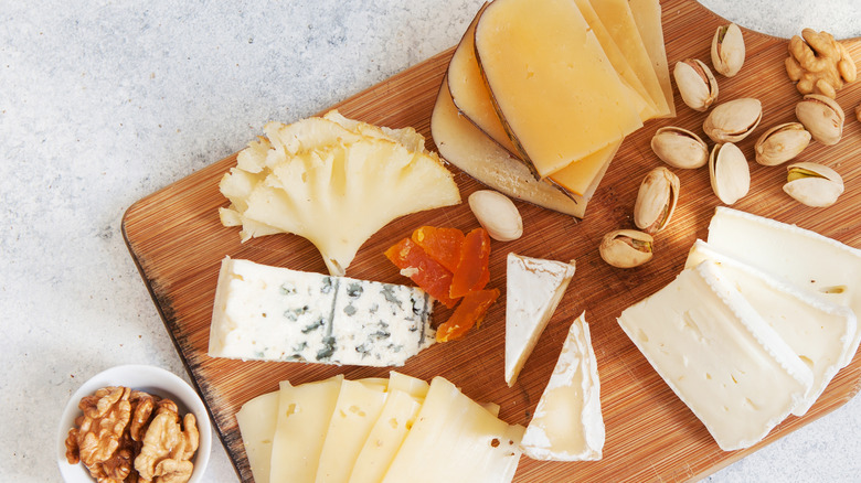 sliced cheese on a board