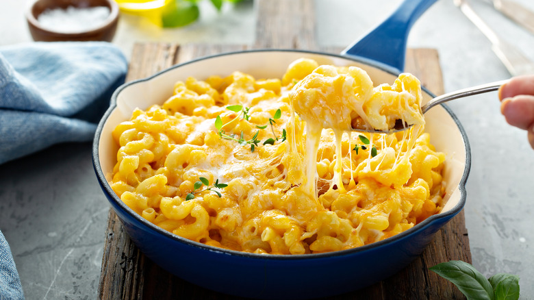 mac and cheese in a pan with fork