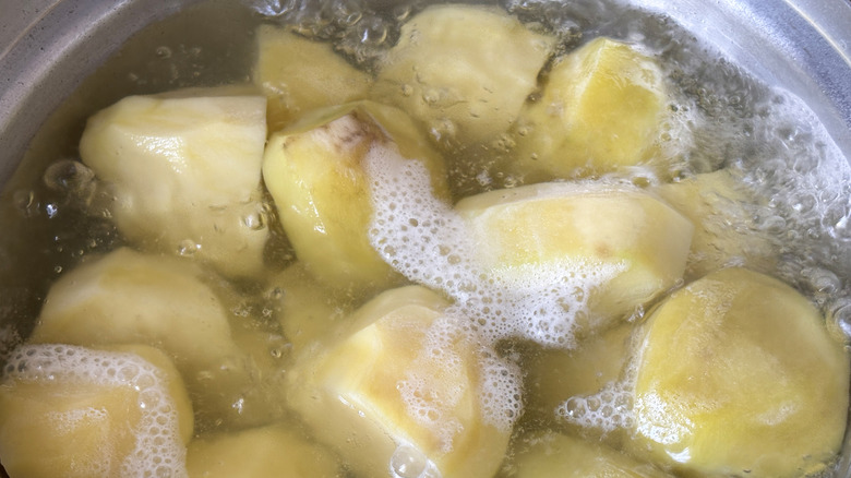 Potatoes in saucepan of water