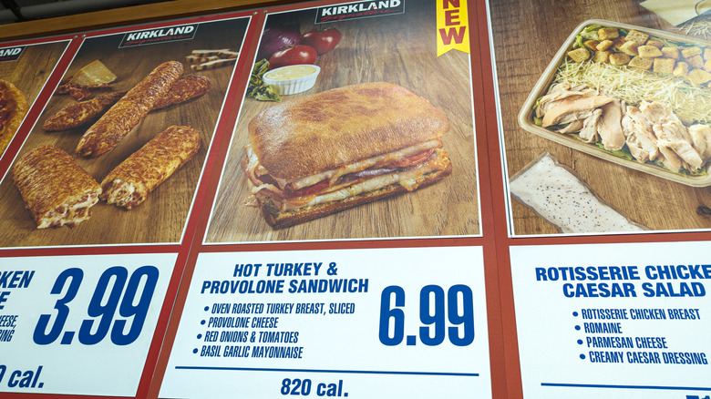 Costco menu board with the $6.99 hot turkey and provolone sandwich