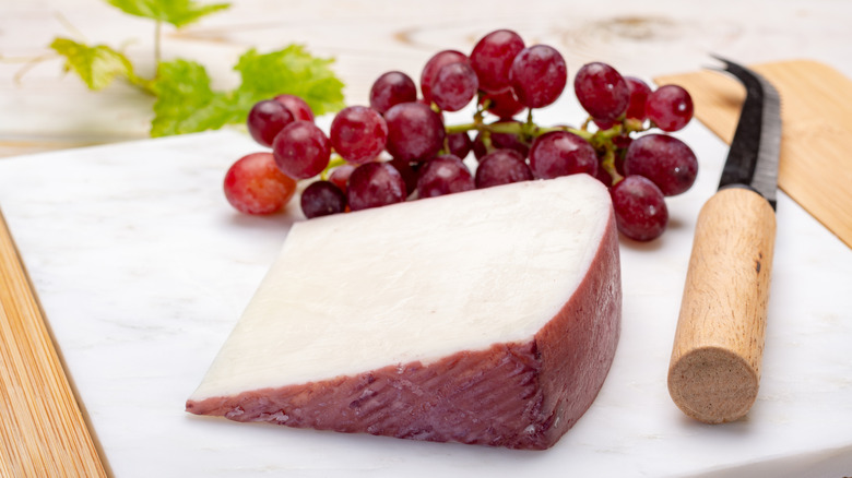 A slice of wine-washed cheese