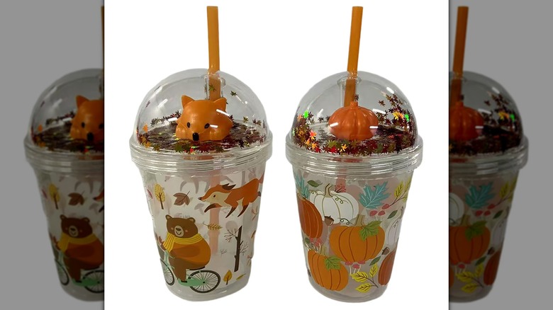 Two reusable cups with domed lids and straws