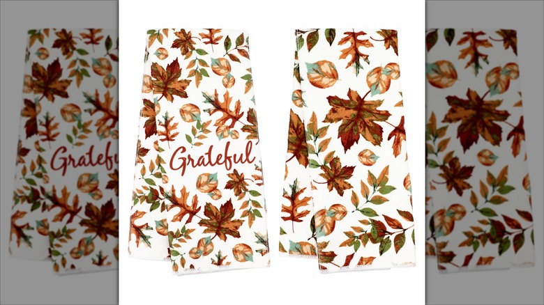 Two dish towels with autumn designs.