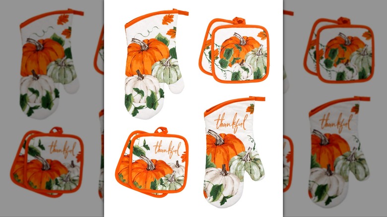 Assorted fall themed oven mitts and pot holders