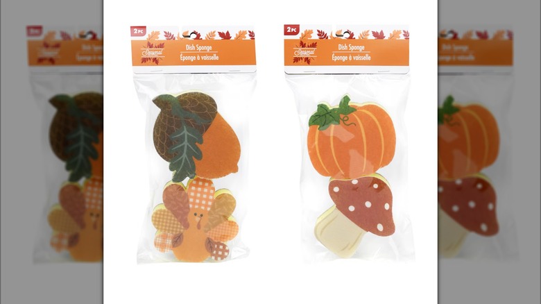 Two packages of fall themed dish sponges in various designs.