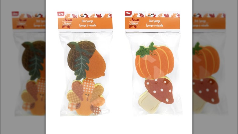 Two packages of fall themed dish sponges in various designs