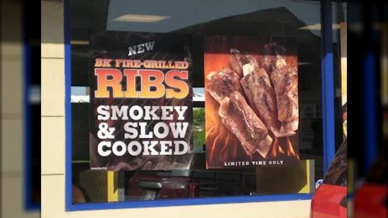 Promotional sign for Burger King's Fire-Grilled Ribs, reading "smokey & slow cooked, limited time only."