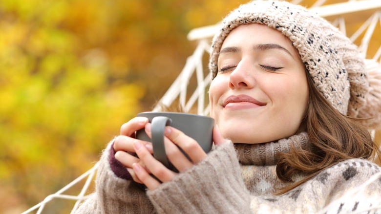 Woman enjoying seasonal coffee