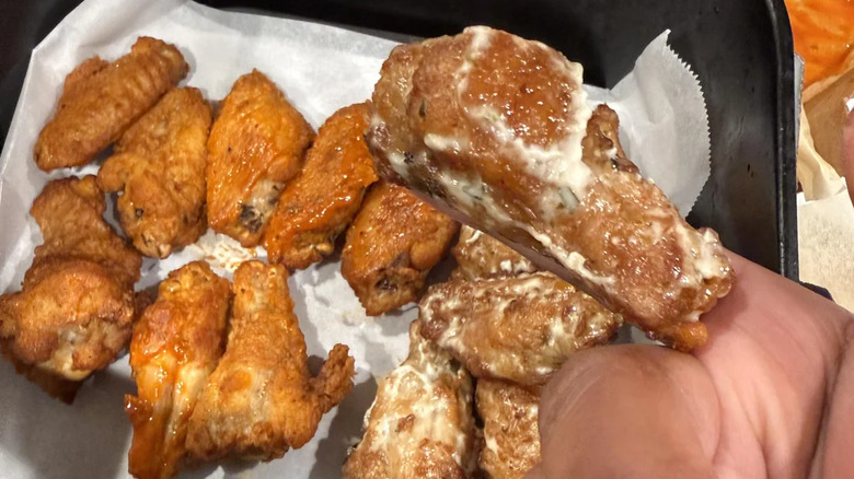 Boxes of Domino's wings with dips