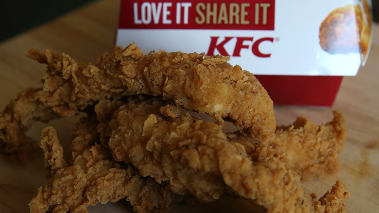 KFC chicken tenders in front of the packaging