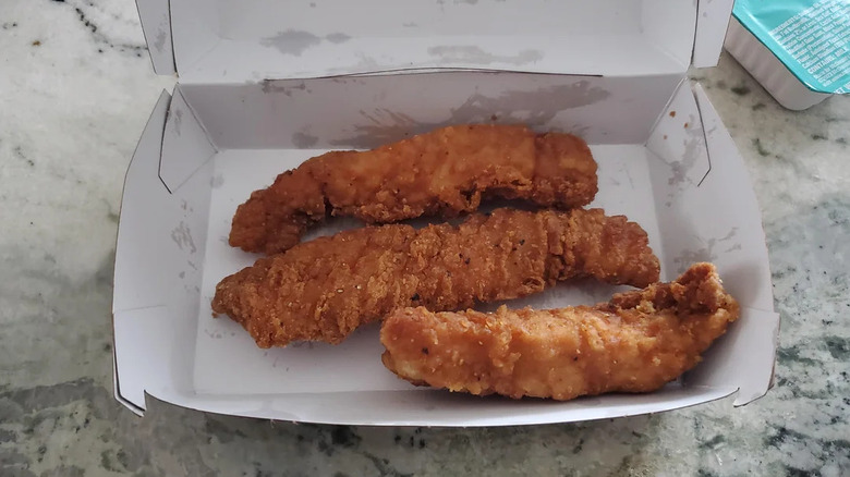 Three McDonald's McCrispy Strips in a box