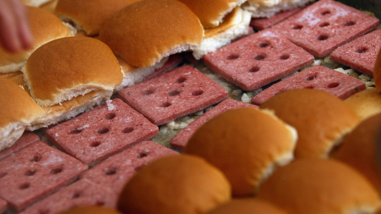 White Castle sliders being cooked with buns