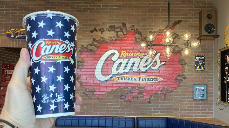 Coke cup from Raising Canes inside the store