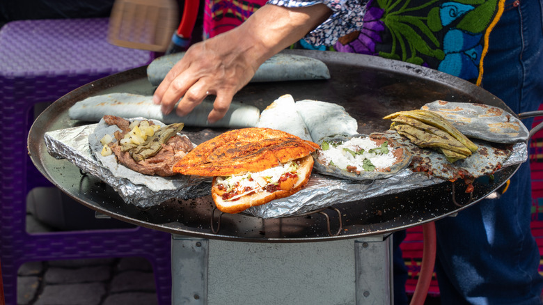 Cook cooking at a street food stall in Mexico