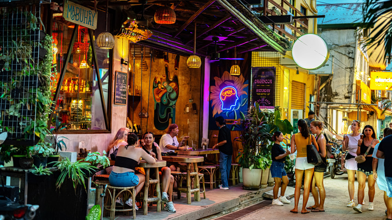 Diners at tables outside restaurant in the Philippines