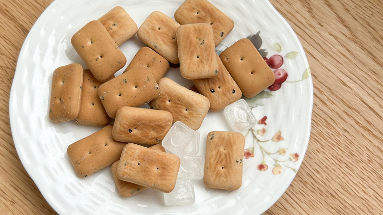 Plate of hardtack biscuits on a wooden table