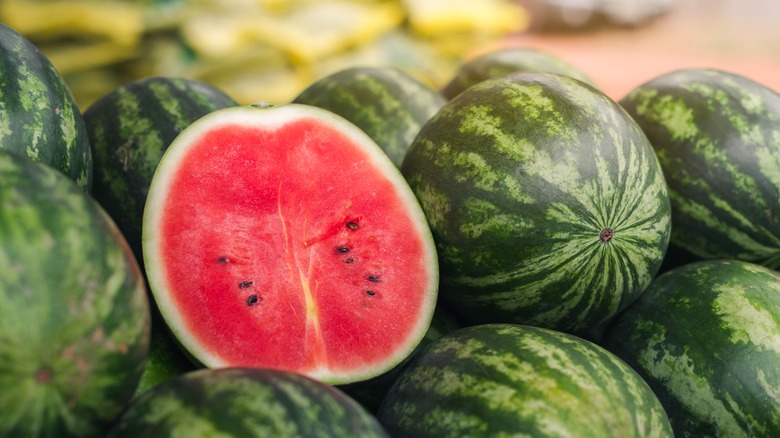 Whole and cut watermelons