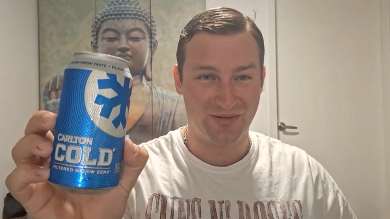 Man holding can of Carlton Cold