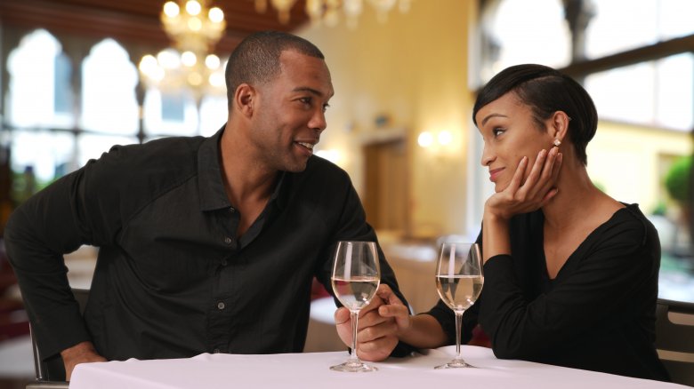 Man and woman eating at nice restaurant