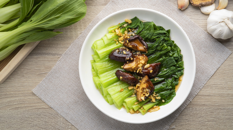 A plate of bok choy and mushrooms