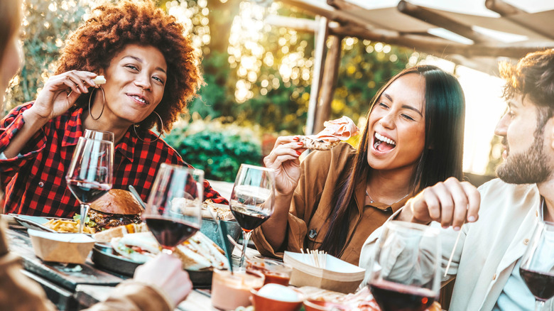 friends eating in pub garden