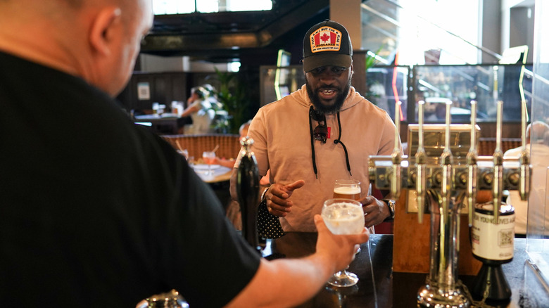 man ordering in bar