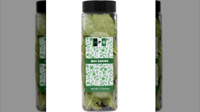 Bottle of whole dried bay leaves.