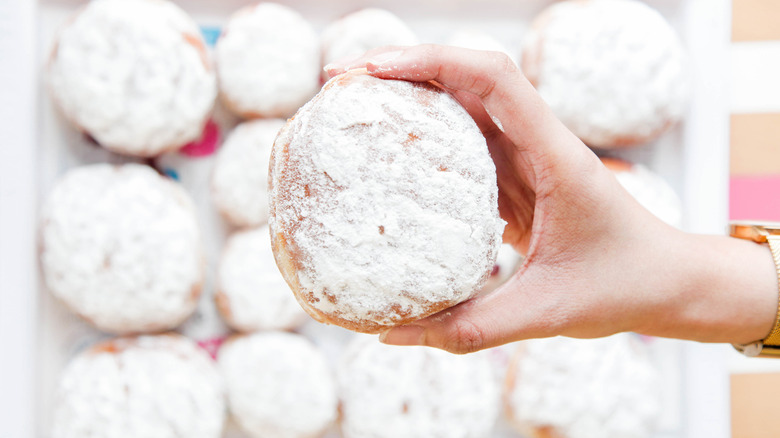 person holds power donut
