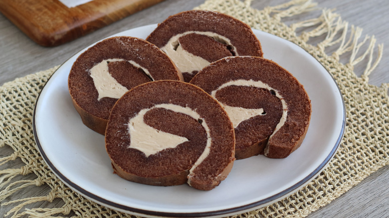 chocolate swiss roll slices on a plate