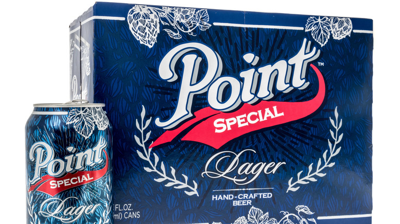 A can of Point Special Lager next to a case full of Point Special Lager