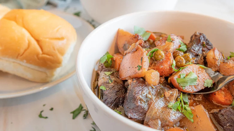 Bowl of beef stew with carrots and potatoes