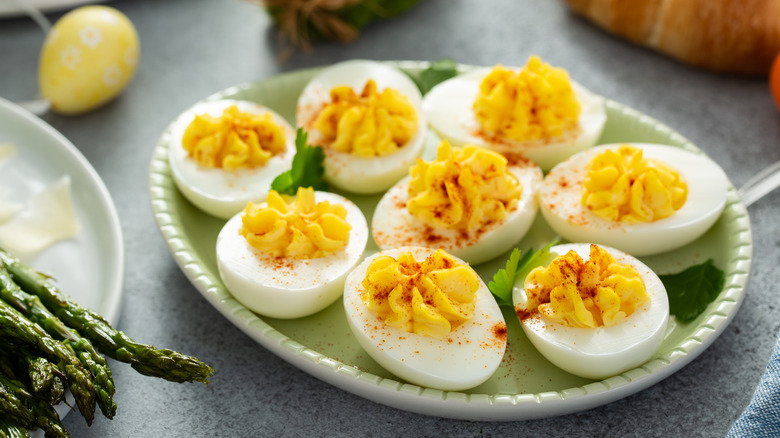 deviled eggs sprinkled with paprika