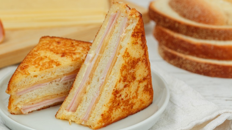Sliced Monte Cristo sandwich on white plate