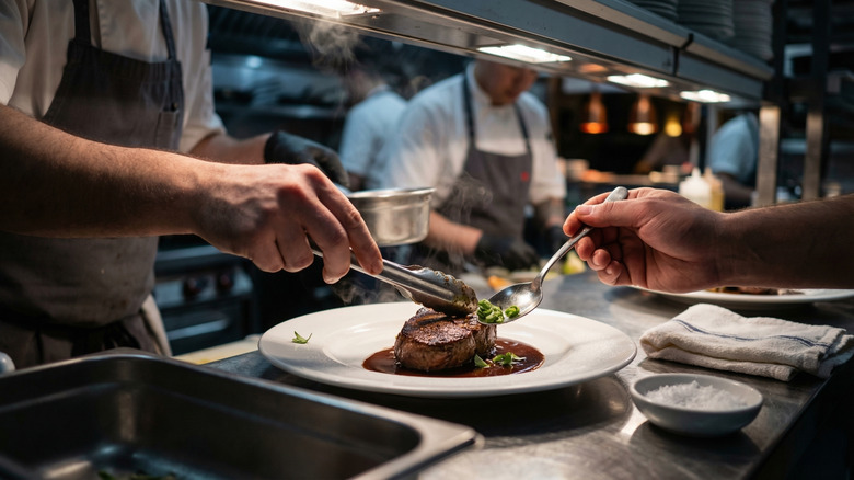 Chefs preparing food in a commercial kitchen